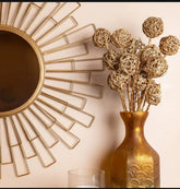 Close-up of sculptural wall mirror frame with elegant texture